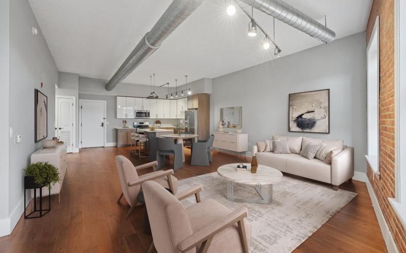 a living room with a couch and chairs