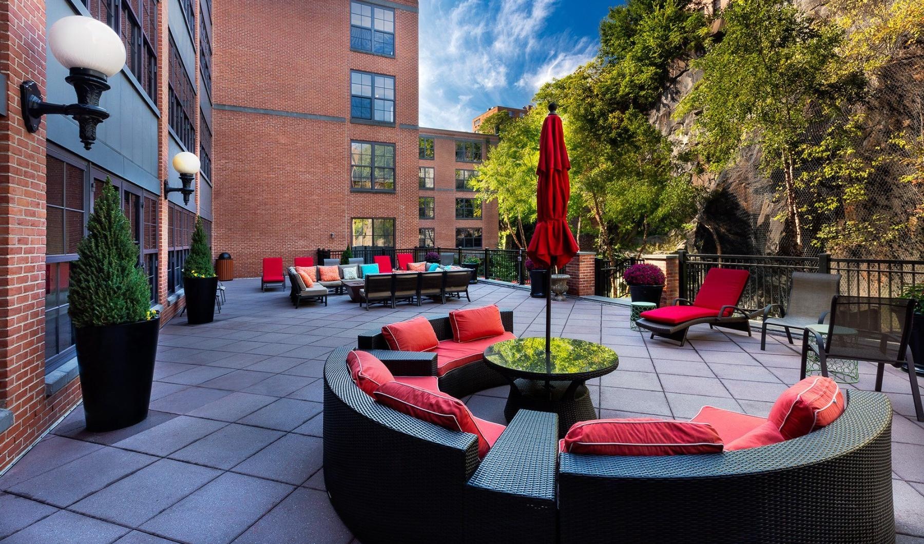 a patio with chairs and tables