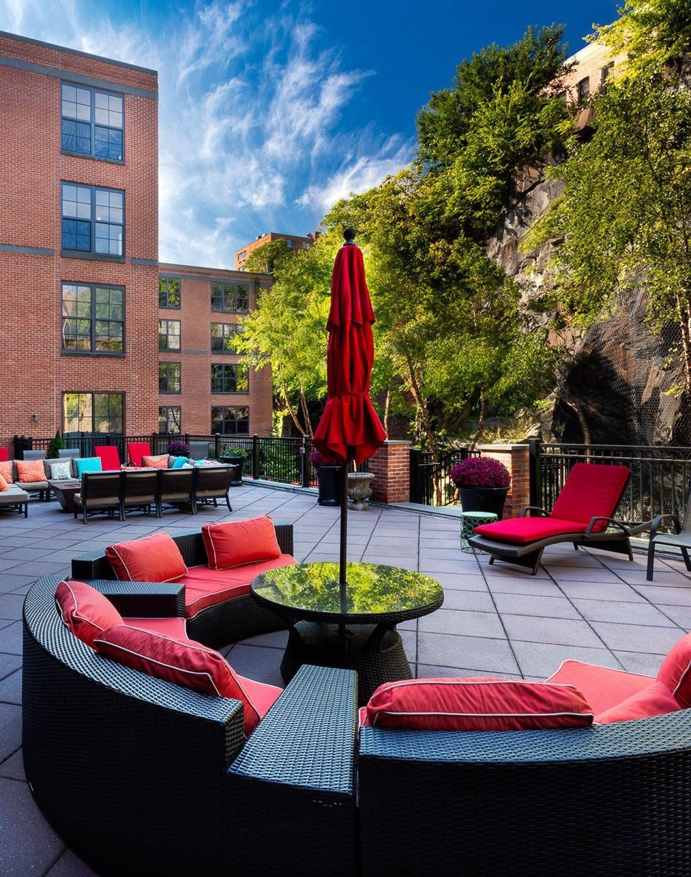 a patio with chairs and tables