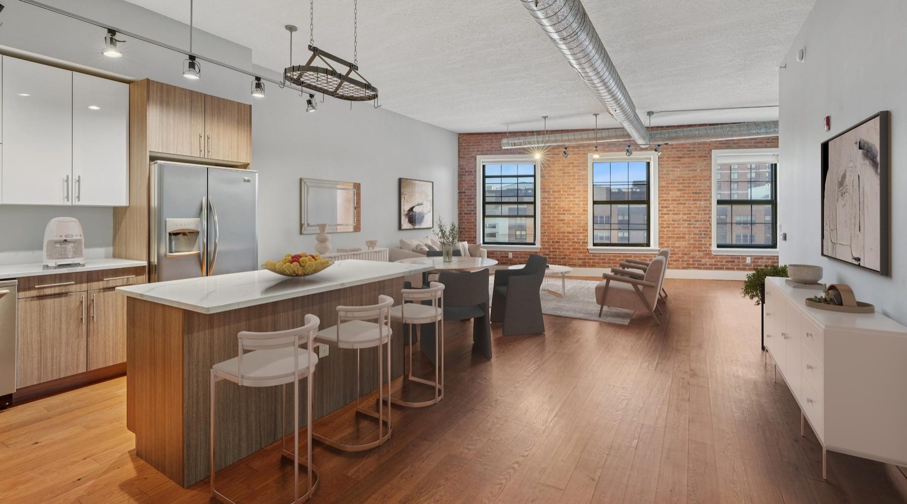 a kitchen with an island and chairs